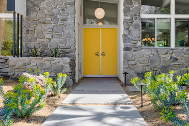 На фото: входная дверь среднего размера в стиле ретро с белыми стенами, двустворчатой входной дверью и желтой входной дверью