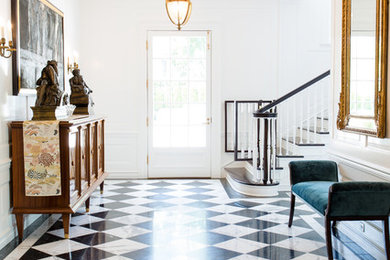 Example of a mid-sized trendy porcelain tile and multicolored floor entryway design in Los Angeles with white walls and a glass front door