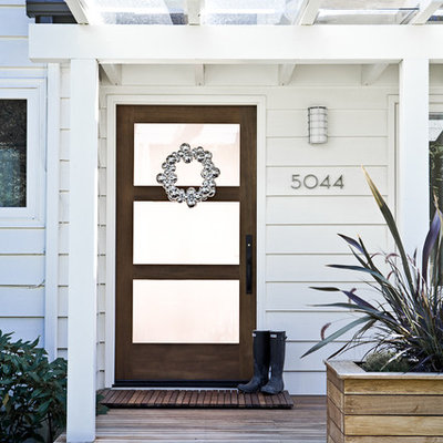 Inspiration for a timeless entryway remodel in Portland with a glass front door