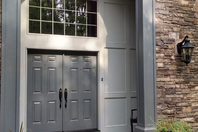 Example of a large classic entryway design in Boston with a gray front door