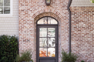 Inspiration for a transitional single front door remodel in Houston with a black front door