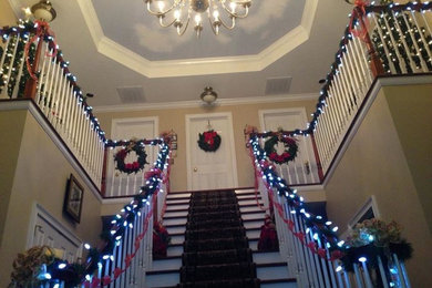 Huge elegant marble floor entryway photo in Nashville with beige walls and a medium wood front door