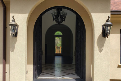 Example of a mid-sized tuscan entryway design in New York