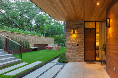 Example of a trendy entryway design in Austin with a medium wood front door