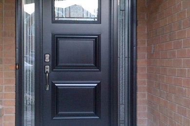 Photo of an entrance in Toronto with a black front door.