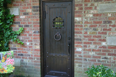 Photo of a large mediterranean front door in Other with a single front door.