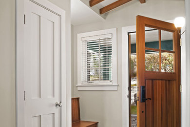 Single front door - transitional slate floor single front door idea in Bridgeport with a medium wood front door