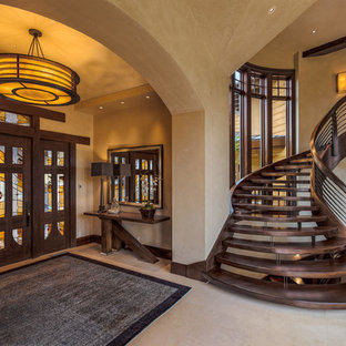 Entryway - contemporary beige floor entryway idea in Salt Lake City with a dark wood front door