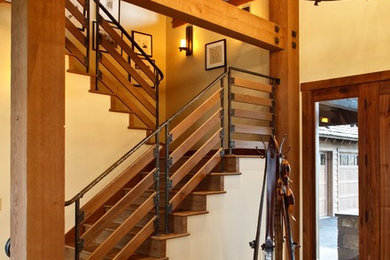 Large mountain style entryway photo in San Francisco with white walls and a medium wood front door