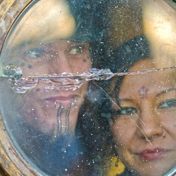 Jethaniel and Yvette peer out of the entry porthole