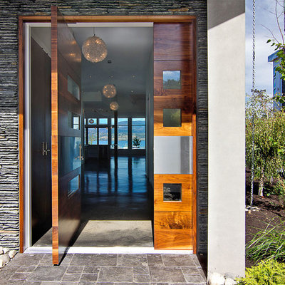Trendy pivot front door photo in Vancouver with a medium wood front door