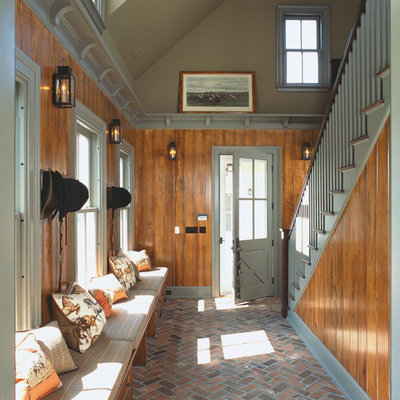 Foyer - country brick floor foyer idea in New York with a gray front door