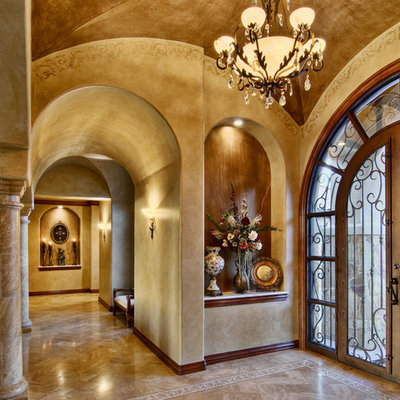 Elegant entryway photo in Austin with beige walls