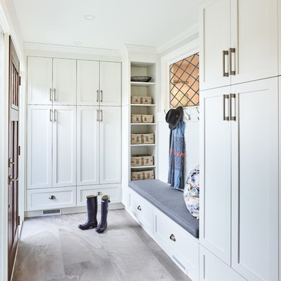 Small transitional porcelain tile and gray floor entryway photo in Vancouver with white walls and a dark wood front door
