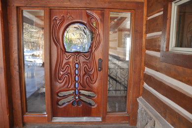 This is an example of a large rustic front door in Other.