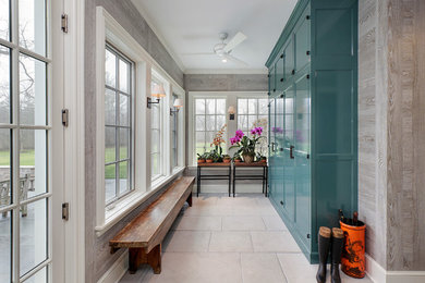Example of a large country mudroom design in Chicago with gray walls