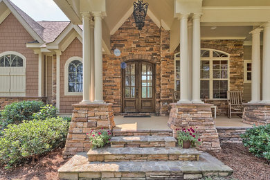 Inspiration for a timeless entryway remodel in Other with a dark wood front door