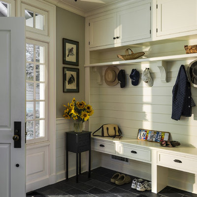 Mudroom - traditional black floor mudroom idea in New York