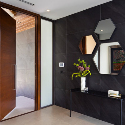 Single front door - contemporary gray floor single front door idea in Miami with a medium wood front door