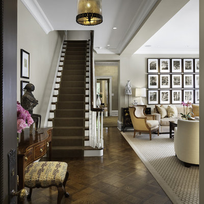 Example of a classic dark wood floor entryway design in Chicago with gray walls