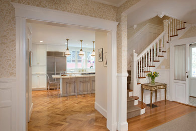 Inspiration for a large traditional foyer in Boston with beige walls and medium hardwood flooring.