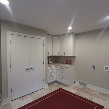 Large Mudroom with Future Laundry Hook Ups and White Cabinets