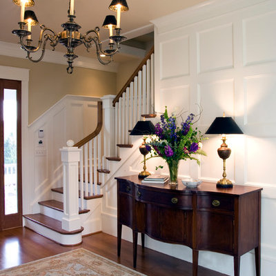 Foyer - large traditional medium tone wood floor and brown floor foyer idea in Richmond with beige walls