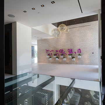 Laurel Way Beverly Hills resort style modern home foyer glass floor walkway Way