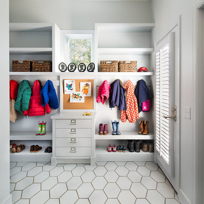 Example of a transitional entryway design in DC Metro with gray walls and a glass front door