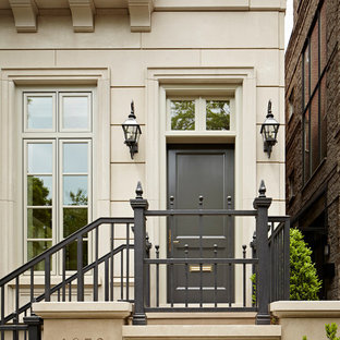 Example of a huge classic entryway design in Chicago with a gray front door