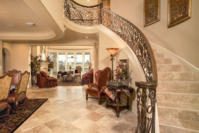 Traditional foyer in Houston with travertine flooring.
