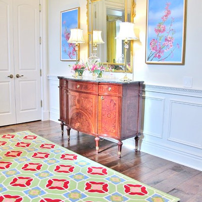 Example of a mid-sized transitional dark wood floor entryway design in Chicago with white walls and a white front door