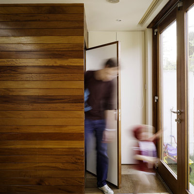 Example of a minimalist entryway design in Dublin with a glass front door