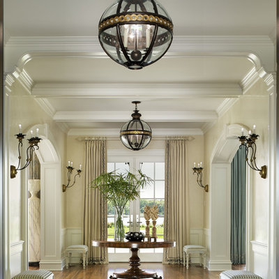 Foyer - large traditional foyer idea in New York with beige walls