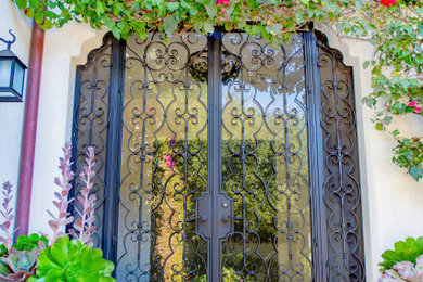 Inspiration for a large timeless front door remodel in Santa Barbara with a black front door