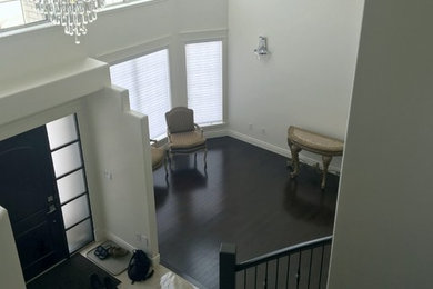 Large elegant porcelain tile and beige floor entryway photo in Other with gray walls and a black front door