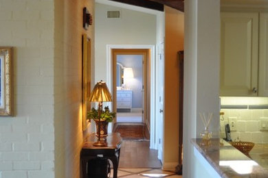 Porcelain tile foyer photo in Austin with beige walls