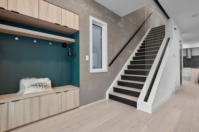 Entryway - light wood floor and beige floor entryway idea in Edmonton