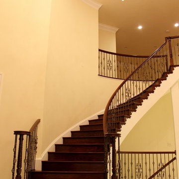 Mediterranean Custom Round Staircase With Iron Balusters