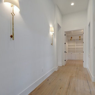Inspiration for a contemporary entryway remodel in Austin with white walls and a metal front door