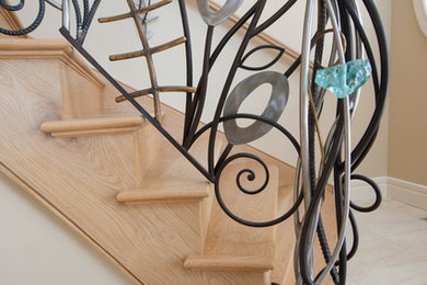 Metal Sculptures Incorporated into Entryway Railing