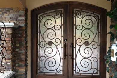 Example of a mid-sized classic entryway design in Los Angeles with beige walls and a dark wood front door
