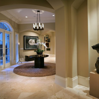 Trendy beige floor foyer photo in Miami with beige walls