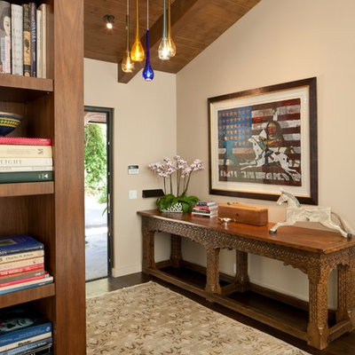 Inspiration for a mid-sized cottage dark wood floor foyer remodel in Los Angeles with beige walls
