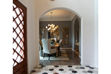 Traditional entrance in Dallas with concrete flooring.