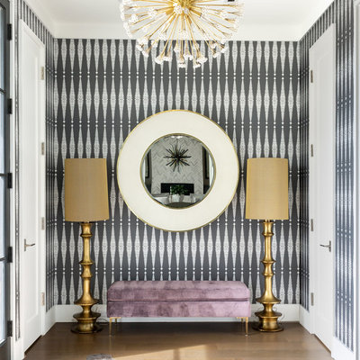 Foyer - contemporary medium tone wood floor foyer idea in Chicago with multicolored walls