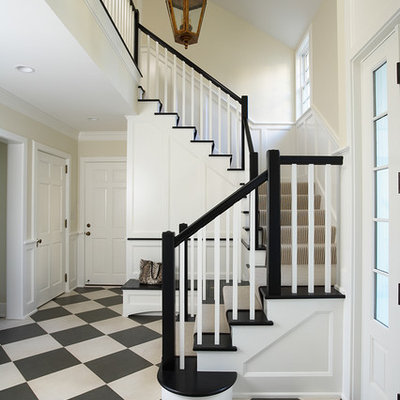 Inspiration for a large timeless multicolored floor foyer remodel in Minneapolis with beige walls