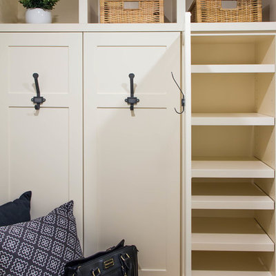 Example of a small cottage porcelain tile and gray floor mudroom design in Calgary with gray walls and a white front door
