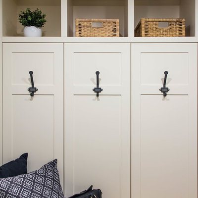 Small country porcelain tile and gray floor mudroom photo in Calgary with gray walls