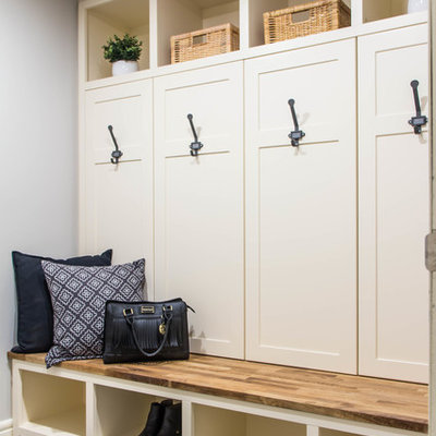 Example of a small country porcelain tile and gray floor mudroom design in Calgary with gray walls